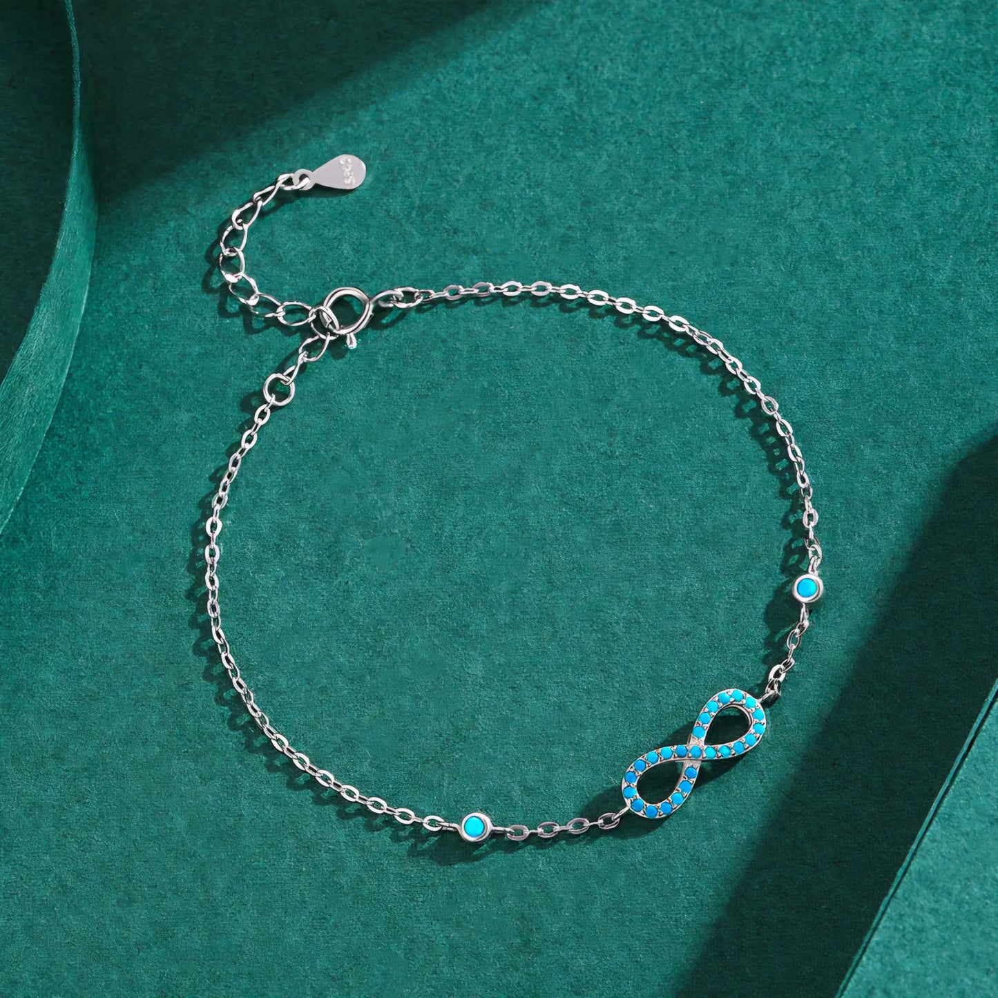 Silver Bracelet with Infinity Symbol and Turquoise Stones